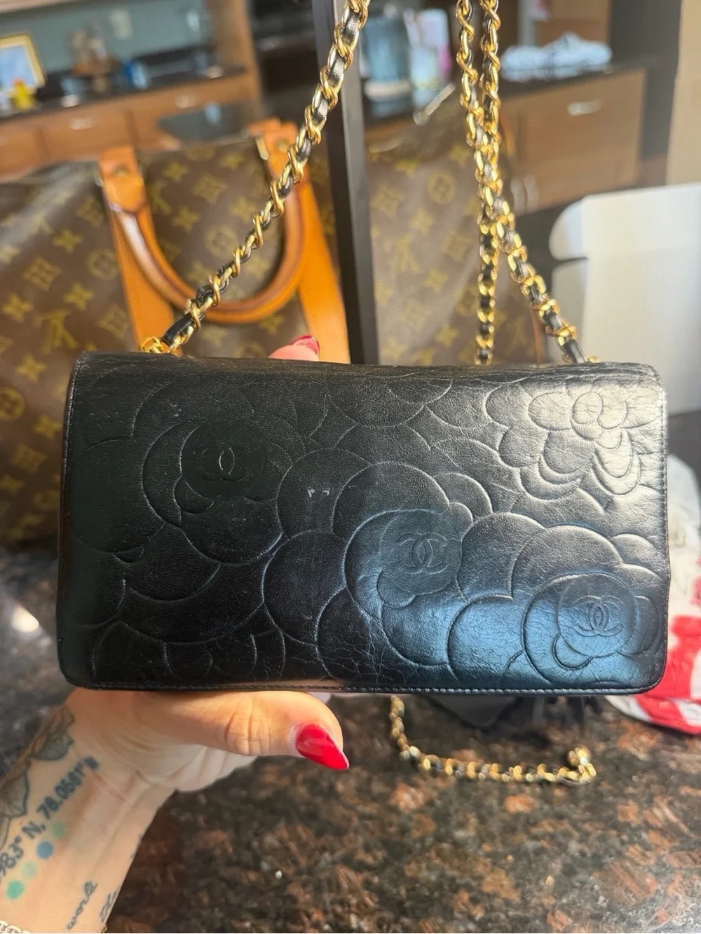 CHANEL Black Quilted Camellia Leather Crossbody with Gold Hardware & Tassel
